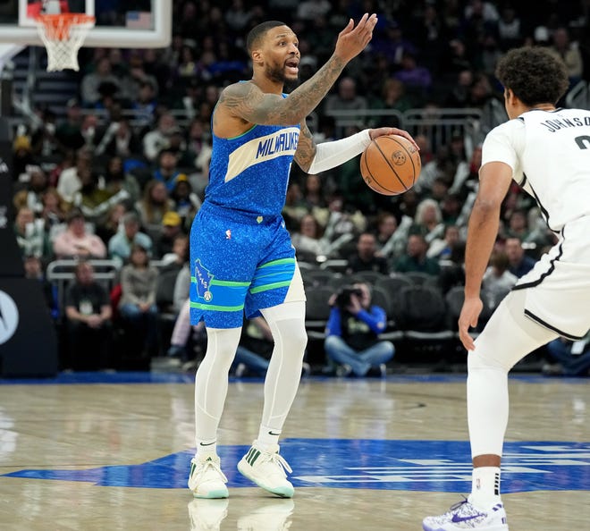 Milwaukee Bucks guard Damian Lillard (0) directs his teammates during the second half of their game Thursday, March 21, 2024 at Fiserv Forum in Milwaukee, Wisconsin. The Milwaukee Bucks beat the Brooklyn Nets 115-108.