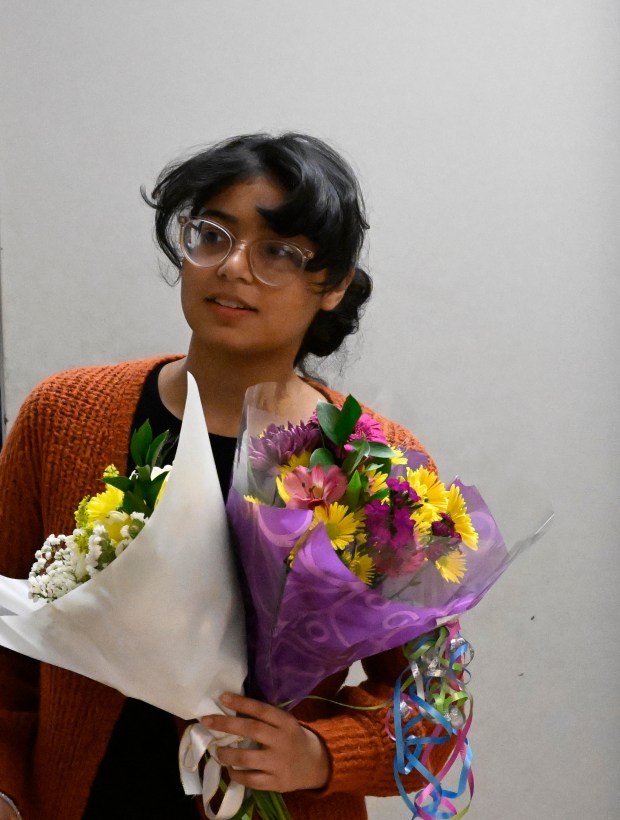 Amaiya Kavachery, a student at Lehigh Career Technical Institute, is awarded a full-tuition scholarship to Cedar Crest College Tuesday, April 9, 2024, at LCTI in North Whitehall Township. Kavachery was the winner of the college's annual scholarship competition, and was presented with her full-tuition prize, flowers and an appearance from Franki the Falcon. (Monica Cabrera/The Morning Call)