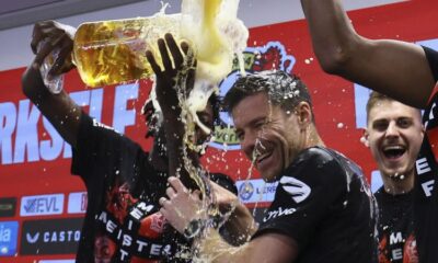 Xabi Alonso drenched in beer by players after Bayer Leverkusen wins first Bundesliga title