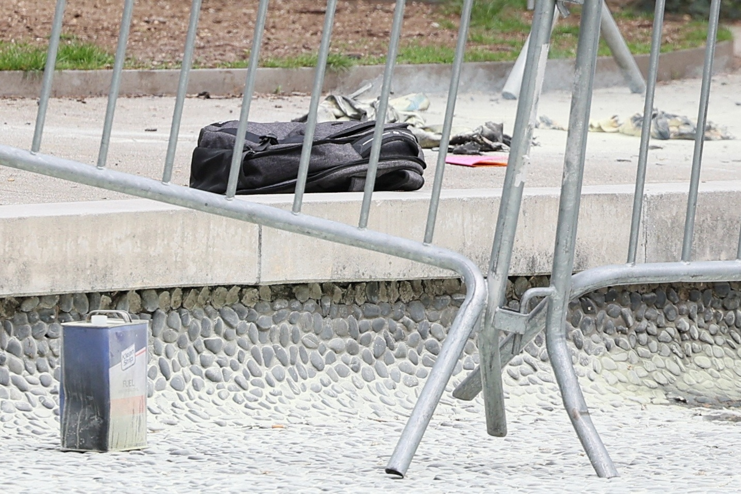 PHOTO: A fuel canister and a backpack are seen, at the scene where a person was covered in flames outside the courthouse where former President Donald Trump's criminal hush money trial is underway, in New York, April 19, 2024.  