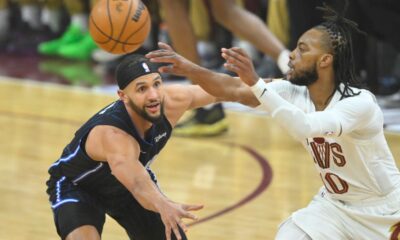 Apr 20, 2024; Cleveland, Ohio, USA; Orlando Magic guard Jalen Suggs (4) defends Cleveland Cavaliers guard Darius Garland (10) in the first quarter during game one of the first round for the 2024 NBA playoffs at Rocket Mortgage FieldHouse. Mandatory Credit: David Richard-USA TODAY Sports