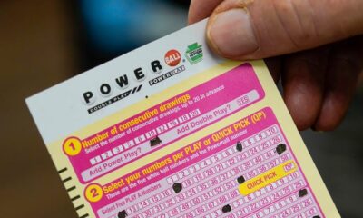 FILE - A person shows their scan card for their personal selection numbers for a ticket for a Powerball drawing on Nov. 7, 2022, at a convenience store in Renfrew, Pa. A winning ticket has been sold in California for Wednesday's drawing on July 19, 2023, for the Powerball jackpot worth $1 billion. (AP Photo/Keith Srakocic, File) ORG XMIT: NYCD503