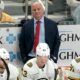 Boston Bruins head coach Jim Montgomery stands behind his bench during the third period of an NHL hockey game against the Pittsburgh Penguins, Saturday, April 13, 2024, in Pittsburgh.