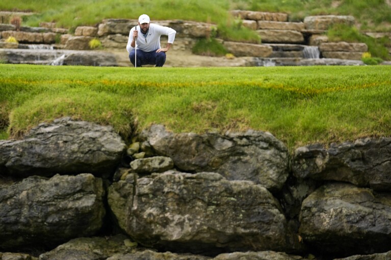 Scottie Scheffler lines up a putt on the 13th hole during the second round of the PGA Championship golf tournament at the Valhalla Golf Club, Friday, May 17, 2024, in Louisville, Ky. (AP Photo/Jeff Roberson)