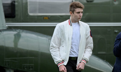 FILE PHOTO: Barron Trump walks to the White House from Marine One in Washington, U.S. August 16, 2020. Photo by Erin Scott...