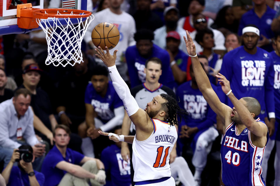 PHILADELPHIA, PENNSYLVANIA - MAY 02: Jalen Brunson #11 of the New York Knicks drives past Nicolas Batum #40 of the Philadelphia 76ers during the third quarter of game six of the Eastern Conference First Round Playoffs at the Wells Fargo Center on May 02, 2024 in Philadelphia, Pennsylvania. (Photo by Tim Nwachukwu/Getty Images)