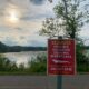 Huron-Clinton Metroparks officials posted warning signs around Kent Lake after a visitor reported seeing an alligator on Thursday.