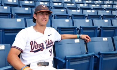 Portrait of Henry Ford in his UVA baseball jersey sitting in the stands