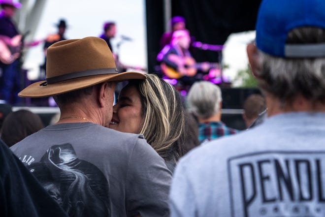 People dance as Willie Nelson and Family performs at Lauridsen Amphitheater at Water Works Park on Saturday, May 25, 2024, in Des Moines.