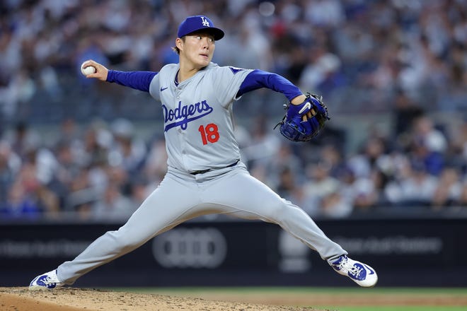 Jun 7, 2024; Bronx, New York, USA; Los Angeles Dodgers starting pitcher Yoshinobu Yamamoto (18) pitches against the New York Yankees during the fifth inning at Yankee Stadium. Mandatory Credit: Brad Penner-USA TODAY Sports