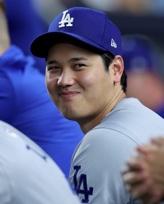 Jun 7, 2024; Bronx, New York, USA; Los Angeles Dodgers designated hitter Shohei Ohtani (17) smiles in the dugout during the sixth inning against the New York Yankees at Yankee Stadium. Mandatory Credit: Brad Penner-USA TODAY Sports