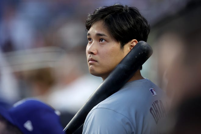 Jun 7, 2024; Bronx, New York, USA; Los Angeles Dodgers designated hitter Shohei Ohtani (17) watches from the dugout during the fifth inning against the New York Yankees at Yankee Stadium. Mandatory Credit: Brad Penner-USA TODAY Sports