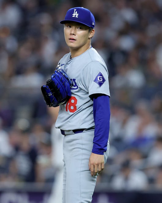 Jun 7, 2024; Bronx, New York, USA; Los Angeles Dodgers starting pitcher Yoshinobu Yamamoto (18) reacts during the sixth inning against the New York Yankees at Yankee Stadium. Mandatory Credit: Brad Penner-USA TODAY Sports