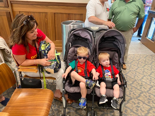 Diane Torres, left, watches her grandchildren, Kingston Torres, 3, and Hudson Torres, 18 months old, during the reception inside City Hall Chambers for the Taunton Day of Portugal ceremony after the flag raising on Saturday, June 8 2024.