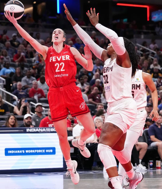 Indiana Fever guard Caitlin Clark (22) goes in for a lay-up against Atlanta Dream forward Cheyenne Parker-Tyus (32) on Thursday, June 13, 2024, during the game at Gainbridge Fieldhouse in Indianapolis. The Indiana Fever defeated the Atlanta Dream, 91-84.