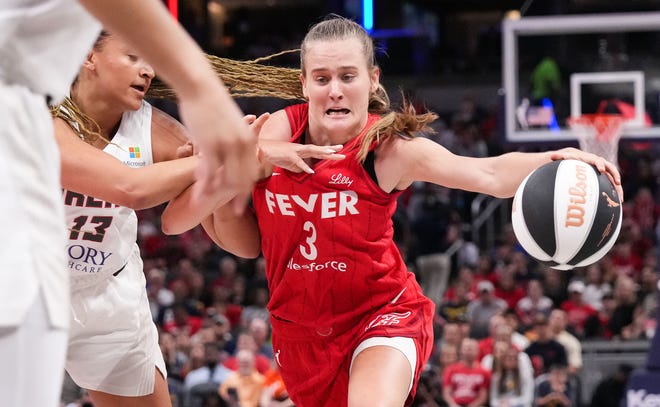 Indiana Fever guard Kristy Wallace (3) rushes up the court against Atlanta Dream guard Haley Jones (13) on Thursday, June 13, 2024, during the game at Gainbridge Fieldhouse in Indianapolis. The Indiana Fever defeated the Atlanta Dream, 91-84.