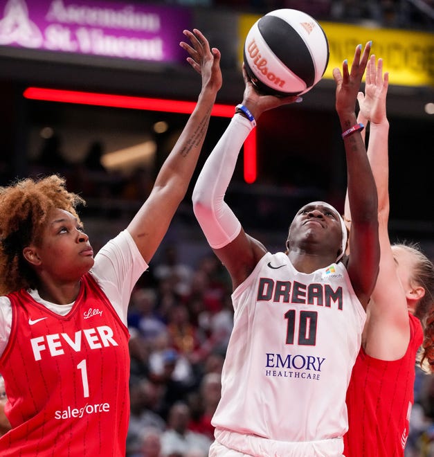 Atlanta Dream guard Rhyne Howard (10) shoots the ball against Indiana Fever forward NaLyssa Smith (1) on Thursday, June 13, 2024, during the game at Gainbridge Fieldhouse in Indianapolis. The Indiana Fever defeated the Atlanta Dream, 91-84.