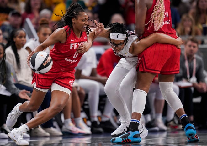 Indiana Fever guard Kelsey Mitchell (0) rushes up the court against Atlanta Dream guard Allisha Gray (15) on Thursday, June 13, 2024, during the game at Gainbridge Fieldhouse in Indianapolis. The Indiana Fever defeated the Atlanta Dream, 91-84.