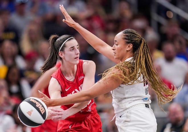 Indiana Fever guard Caitlin Clark (22) passes the ball against Atlanta Dream guard Haley Jones (13) on Thursday, June 13, 2024, during the game at Gainbridge Fieldhouse in Indianapolis. The Indiana Fever defeated the Atlanta Dream, 91-84.