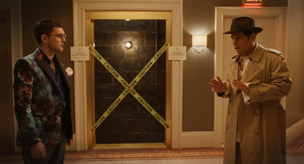 Two men arguing outside a broken elevator