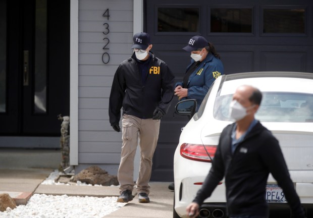 FBI agents exit the home of California Waste Solutions Director Andy Duong on View Crest Court in Oakland Calif., on Thursday, June 20, 2024. (Jane Tyska/Bay Area News Group)