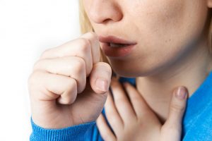 Woman coughing