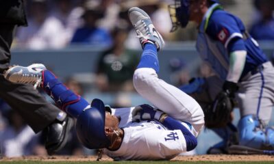 Dodgers star Mookie Betts suffers broken left hand when hit by a pitch