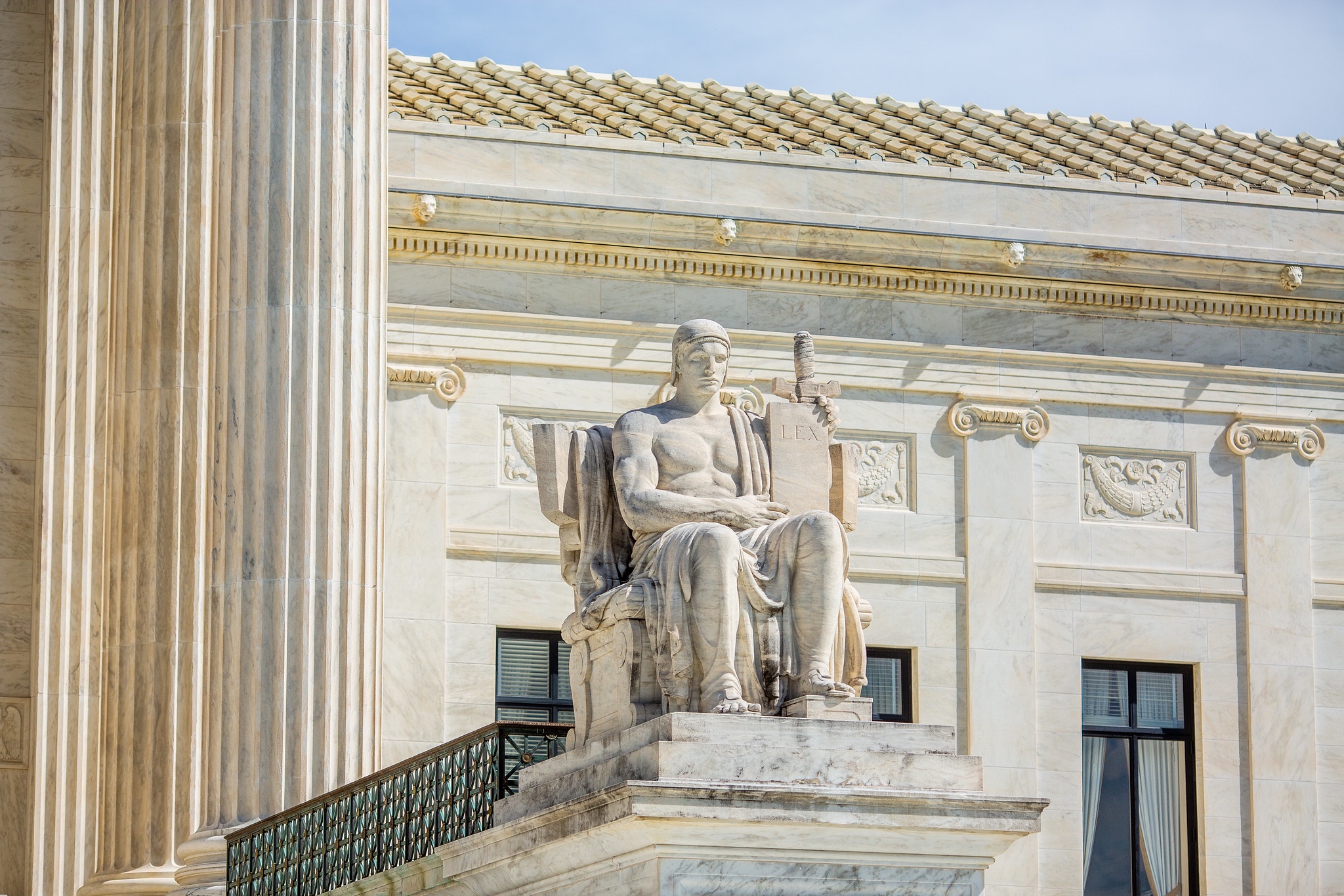 A statute on the steps on the Supreme Court