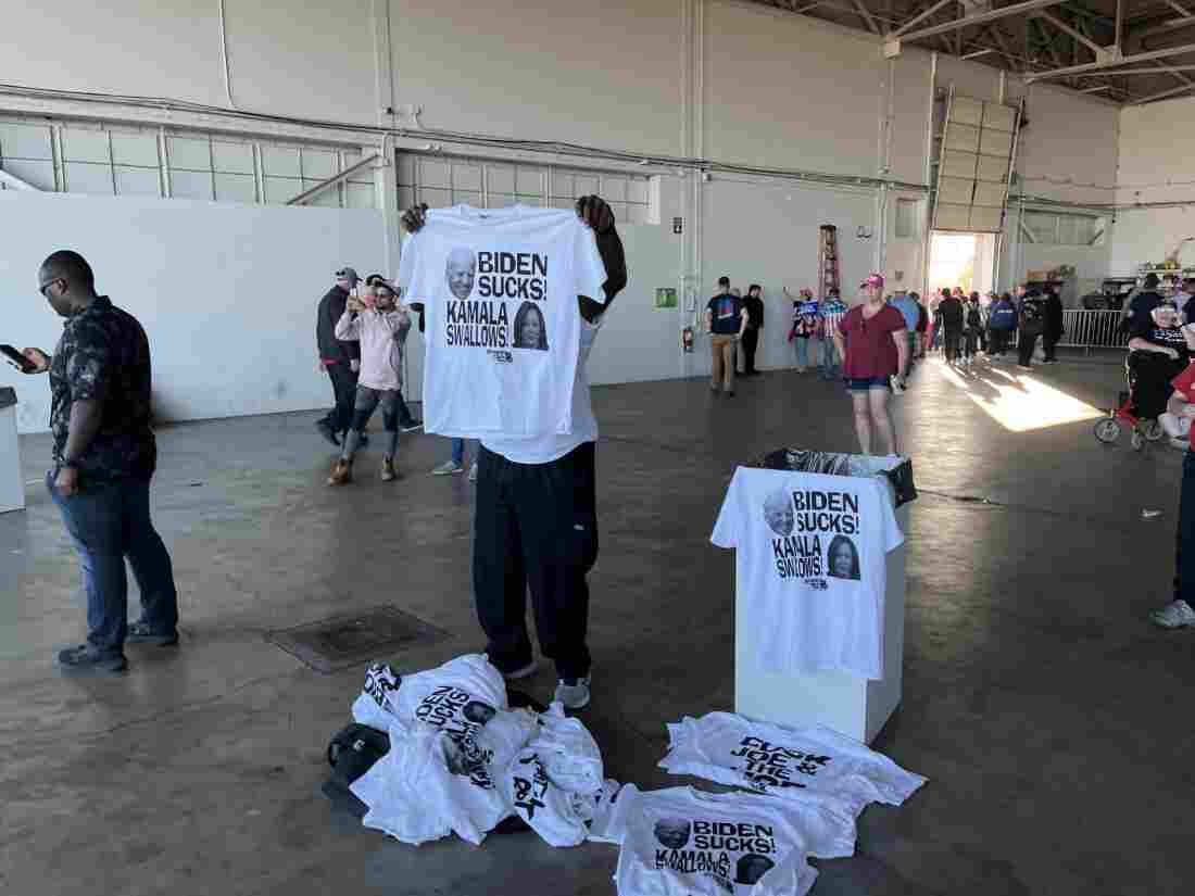 A vendor sells t-shirts at a May 1, 2024, Trump rally in Freeland, Michigan.