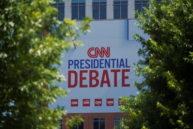 Signs promoting the debate between U.S. President Joe Biden and his rival Donald Trump are erected around the venue at CNN Center in Atlanta, Georgia, U.S. June 24, 2024. REUTERS/Megan Varner