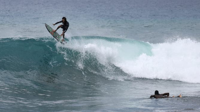 KINGSTON, JAMAICA - JULY 03: Surfers enjoy the waves before the arrival of Hurricane Beryl on July 03, 2024 in Kingston, Jamaica. Category 4 storm Beryl has caused widespread damage in several island nations as it continues to cross the Caribbean. (Photo by Joe Raedle/Getty Images)