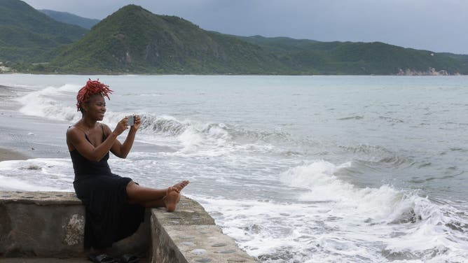 KINGSTON, JAMAICA - JULY 03: Keera Walters looks out at the ocean before the arrival of Hurricane Beryl on July 03, 2024 in Kingston, Jamaica. Category 4 storm Beryl has caused widespread damage in several island nations as it continues to cross the Caribbean. (Photo by Joe Raedle/Getty Images)