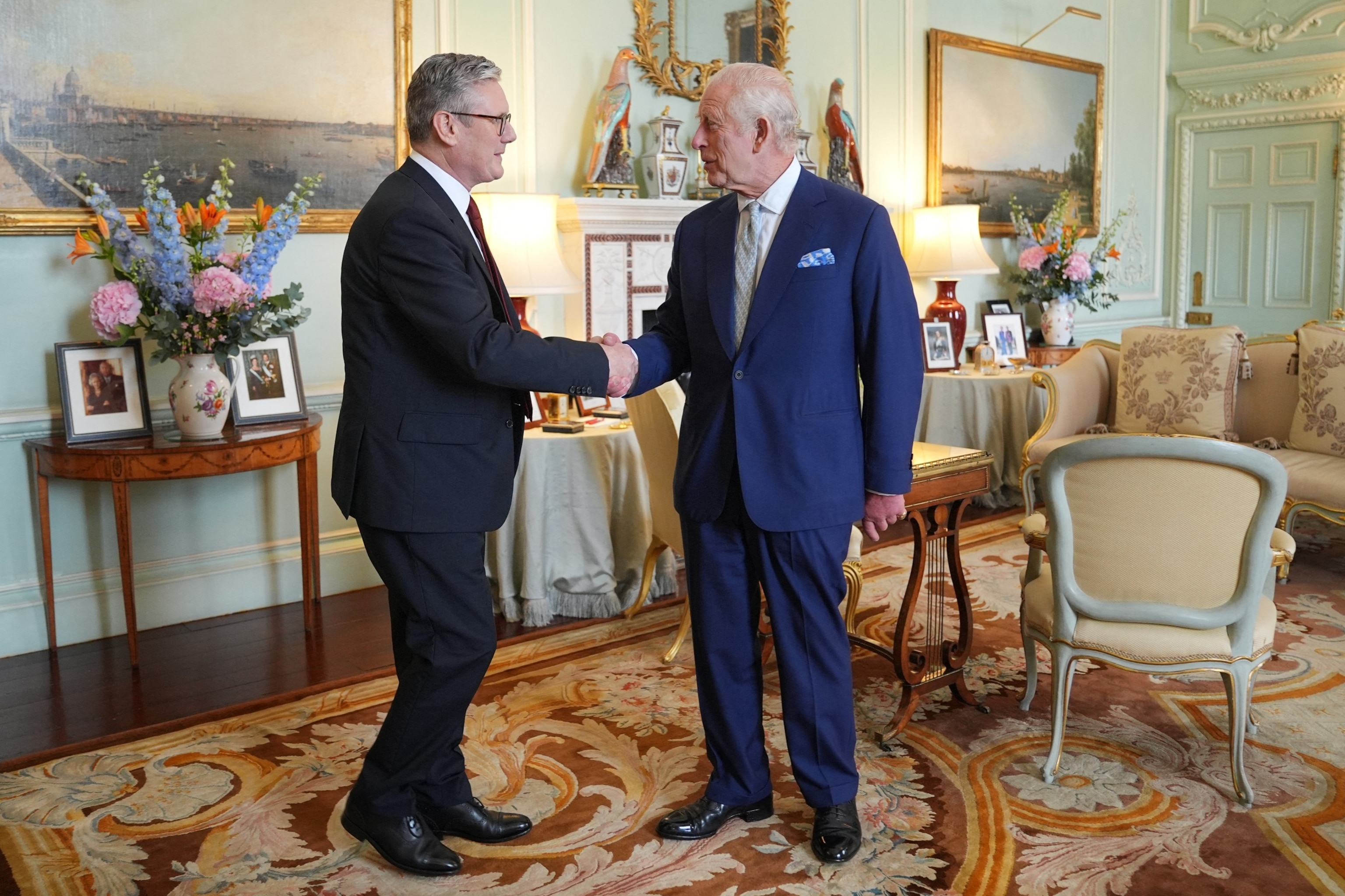 PHOTO: Britain's King Charles III welcomes Britain's incoming Prime Minister Keir Starmer during an audience at Buckingham Palace in London, July 5, 2024.