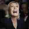 French far right leader Marine Le Pen reacts as she meets supporters and journalists after the release of projections based on the actual vote count in select constituencies on Sunday in Henin-Beaumont, northern France.