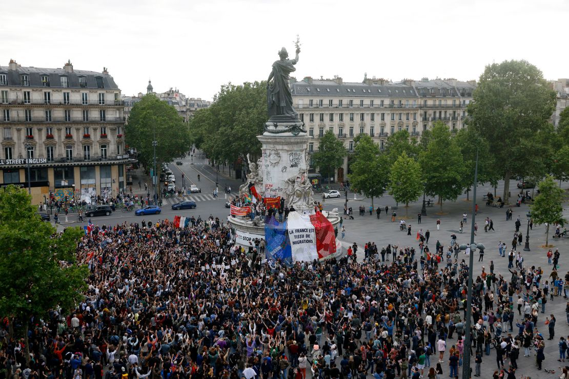 A giant French flag reads 