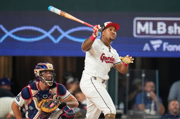 The Cleveland Guardians’ Jose Ramirez follows through during the MLB...