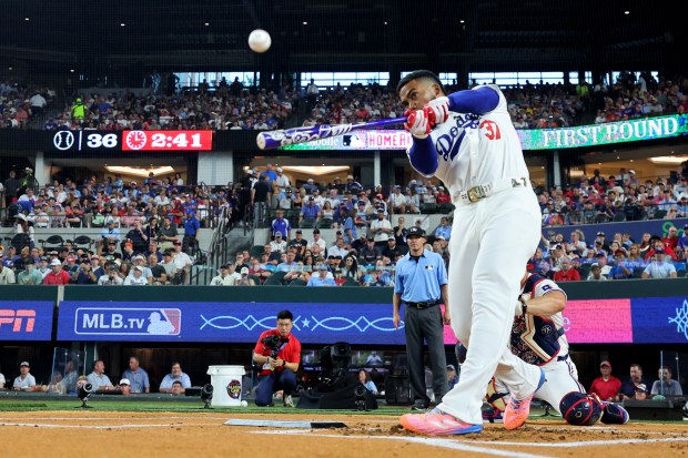 Dodgers outfielder Teoscar Hernández bats during the Home Run Derby...