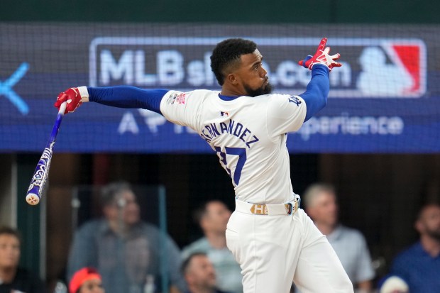 Dodgers outfielder Teoscar Hernández follows through during the MLB baseball...