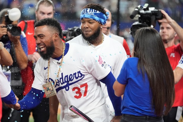 Dodgers outfielder Teoscar Hernández celebrates after winning the All-Star Home...