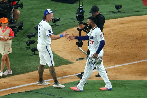 Kansas City Royals shortstop Bobby Witt Jr., left, and Dodgers...