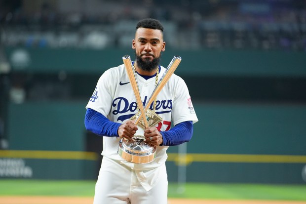 Dodgers outfielder Teoscar Hernández, poses for photos with the winner’s...