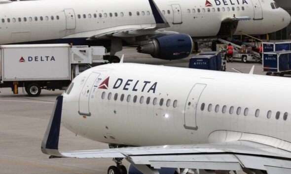 Delta's flight delays and cancellations prompt Dept. of Transportation investigation : NPR