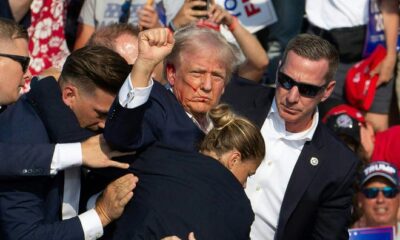 Republican candidate Donald Trump is seen with blood on his face surrounded by secret service agents as he is taken off the stage at a campaign event at Butler Farm Show Inc. in Butler, Pennsylvania, July 13, 2024. Donald Trump was hit in the ear in an apparent assassination attempt by a gunman at a campaign rally on Saturday. Sunday, Mississippi State Auditor Shad White called for U.S. Congressman Bennie Thompson to resign after one of his staffers posted support for the would be assassin.