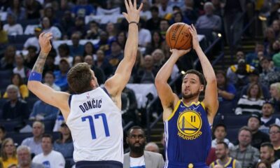 March 23, 2019; Oakland, CA, USA; Golden State Warriors guard Klay Thompson (11) shoots the basketball against Dallas Mavericks forward Luka Doncic (77) during the third quarter at Oracle Arena. Mandatory Credit: Kyle Terada-USA TODAY Sports