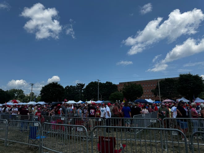 A long line of people wait to enter the New Holland Arena for the Trump rally July 31, 2024.