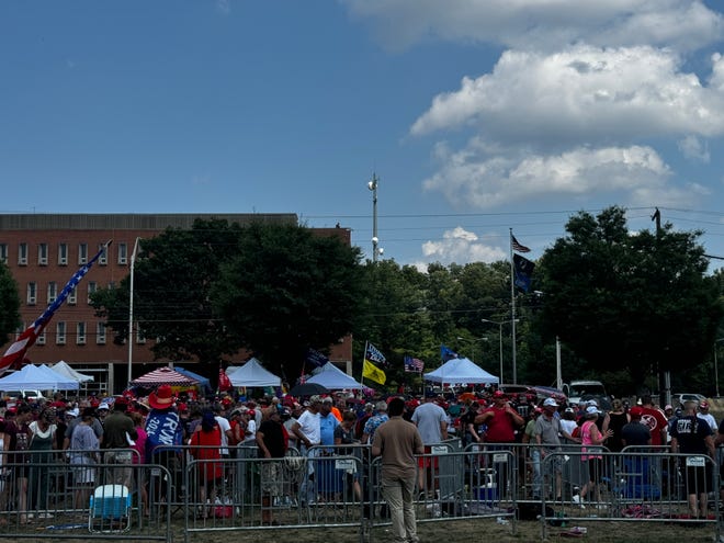 A long line of people wait to enter the New Holland Arena for the Trump rally July 31, 2024.