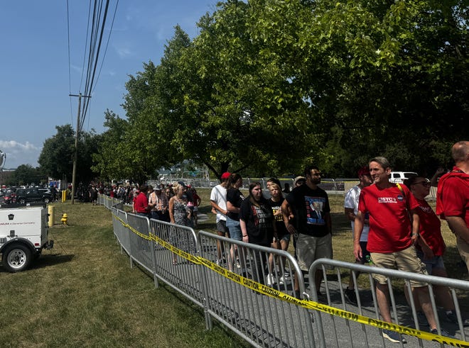 A long line of people wait to enter the New Holland Arena for the Trump rally July 31, 2024.