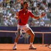 Serbia's Novak Djokovic reacts to beating Spain's Carlos Alcaraz to win gold after their men's singles final tennis match at the Roland-Garros Stadium Sunday during the Paris Olympics. It was Djokovic's first-ever gold medal.