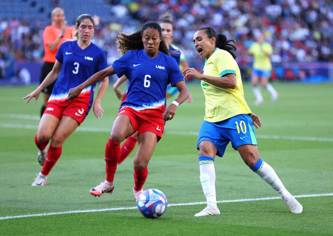 Brazilian superstar Marta (right), playing in her sixth Olympics, controls the ball against Casey Krueger of the U.S. during the women's Gold Medal match. The U.S. defeated Brazil 1-0.