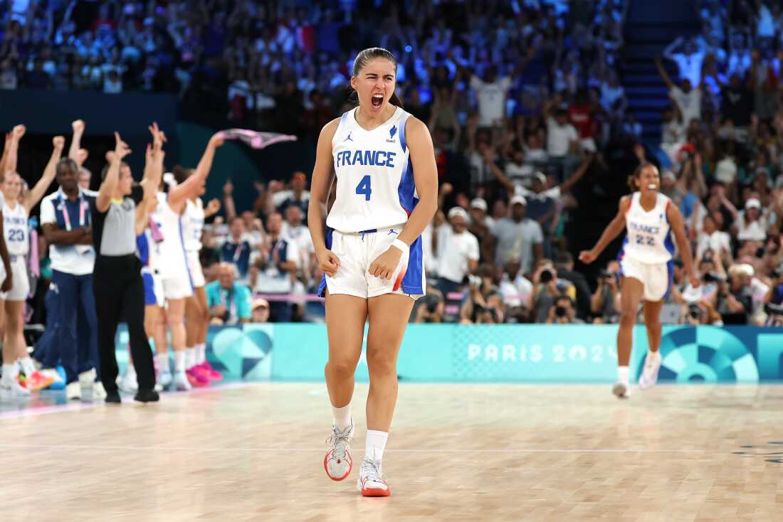 France's Marine Fauthoux reacts after a three point basket during the women's gold medal basketball game between the United States and host France.